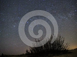 Night sky and milky way stars, Perseus constellation over sea