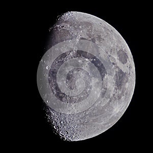 Moon on night sky over telescope