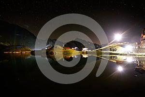 Night sky over Balea Lake, Transylvanian Alps, Romania photo