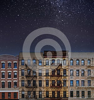 Night sky with shining stars above buildings in New York City