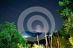 Night sky with stars and the Milky Way over the Rhodope Mountains in Bulgaria