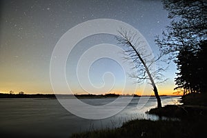 Night sky stars observingn over river in Latvia