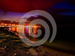 Night Skyline Of City On The Seaside