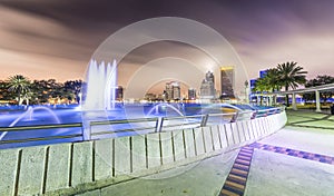 Night skyline of Jacksonville with buildings and square fountain