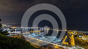 Night skyline from Montjuic with Port Vell timelapse, Barcelona, Catalonia, Spain photo