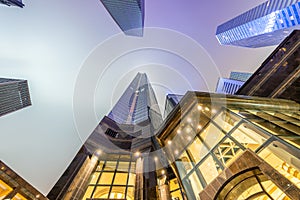 Night skyward view of metropolis skyscrapers. Business and corporate concept