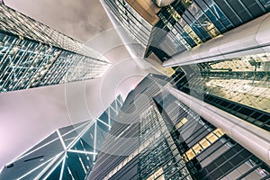 Night skyward view of metropolis skyscrapers. Business and corporate concept