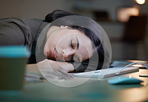 Night, sleeping and tired woman on her desk computer with depression, burnout and mental health risk. Business person
