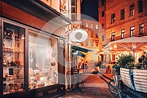 Vienna, Austria. People sitting at street cafe at night in St. Urlich, Neubau District