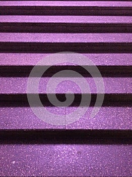 Photo of night stairs with purple steps