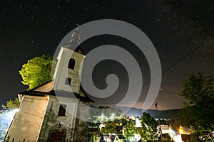 Night stars and milky way galaxy above slovakian village