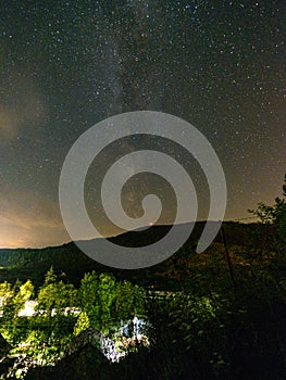 Night stars and milky way galaxy above slovakian village