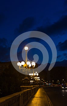 Night street with lanterns in summer in Valencia, Spain