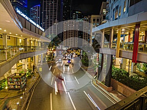 Night street scene from Eastwood neighborhood in Manila photo