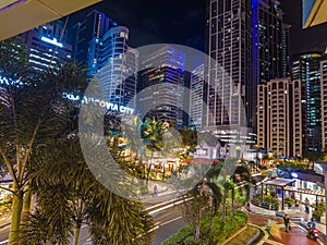 Night street scene from Eastwood neighborhood in Manila photo