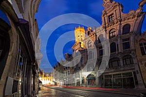 Night street and tower Belfort in Bruges, Belgium