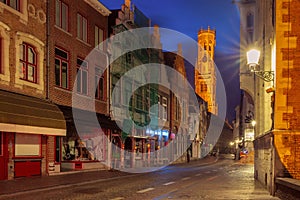 Night street and tower Belfort in Bruges, Belgium