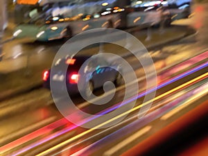 Night street traffic cars on road bus and blurred light reflection on wet asphalt  after rain city life stile urban