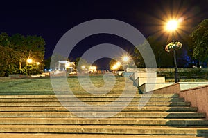 Night street view of Odessa city, Ukraine, Potemkin stairs near the Primorskiy boulevard, walking people