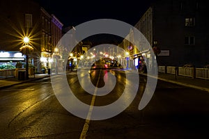 Night street view with wet asphalt reflecting lights in Port Hope, Ontario, Canada photo