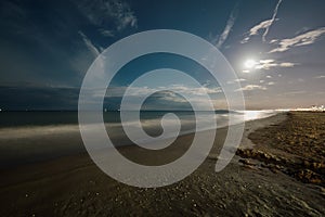 Night summer sand beach with full moon. Seascape