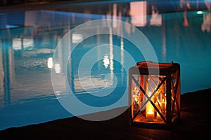 Night swimming pool and candles