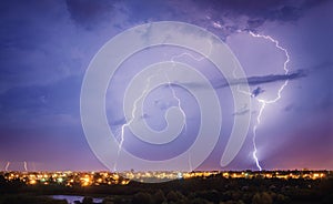 Thunderstorm, flash of lightning above the city photo