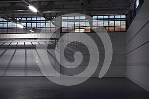 Night Time At Empty Hangar Interior or Empty Warehouse With Roller Shutter Door and Concrete Floor. 3d rendering