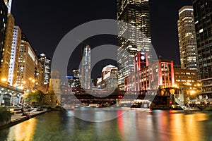 Night time exterior establishing shot overlooking Chicago river