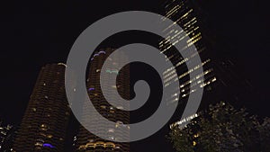 Night time exterior establishing shot of riverfront skyline in Chicago