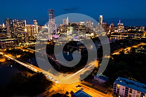 Night time nightscape aeral drone view above Austin Texas Skyline Cityscape illuminated city lights