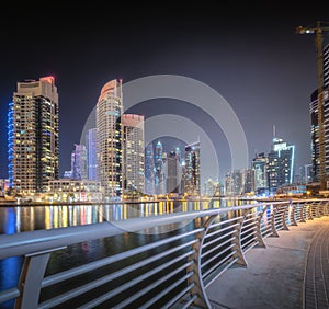 Night time panoramic view of Dubai Marina bay and city center, UAE