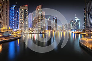 Night time panoramic view of Dubai Marina bay and city center, UAE