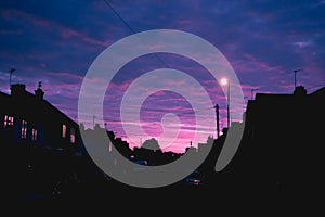 Night time view of house exterior of terraced houses on a street