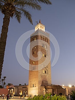 night time view of the koutoubia mosque's minaret near the jemaa el-fnaa market in marrakesh