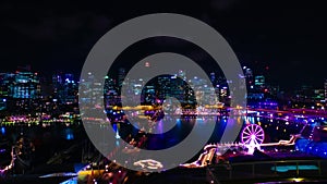 A night timelapse of panoramic bayarea at Darling harbour in Sydney high angle wide shot tilt