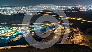 Night timelapse with rocks from Jebel Hafeetwith impressive view over the city.