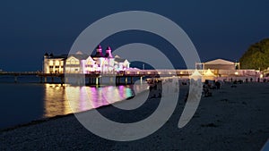NIght TImelapse Of Sellin Pier Lit With Colorful Illumination During Concert, Silhouette of People