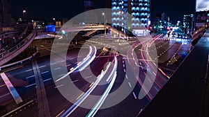 A night timelapse of the traffic jam at the crossing in Tokyo wide shot panning