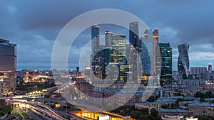 Night to day view of the city traffic timelapse and Building of Moscow International Business Center Moscow-City