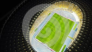 Night top down aerial view of Soccer stadium in downtown Kyiv, Ukraine. Tourism landmark of city. Soccer field. Football