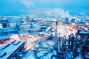 Night top view of steel mill. Smog, smoke and flame from the chimneys