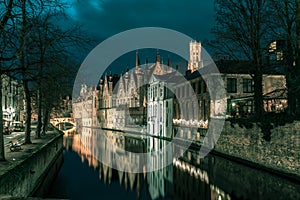 Night tower Belfort and the Green canal in Bruges