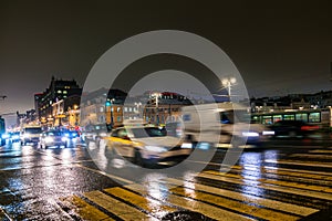 Night traffic in the capital on the high-speed highway.Big city lights.Central district