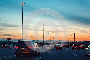 Night traffic, cars on highway road on sunset evening night in busy city