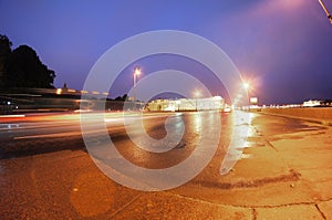 Night traffic on city embankment