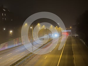 Night traffic in the foggy Munich city, Bavaria, Germany, November 2022