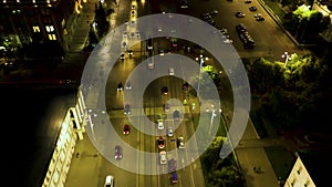 Night traffic movement at the center of big city, aerial urban view. Shot. Aerial view of night road with moving cars and beautifu