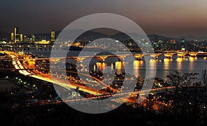 Night traffic over han river in seoul photo