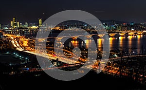 Night traffic over han river in seoul photo